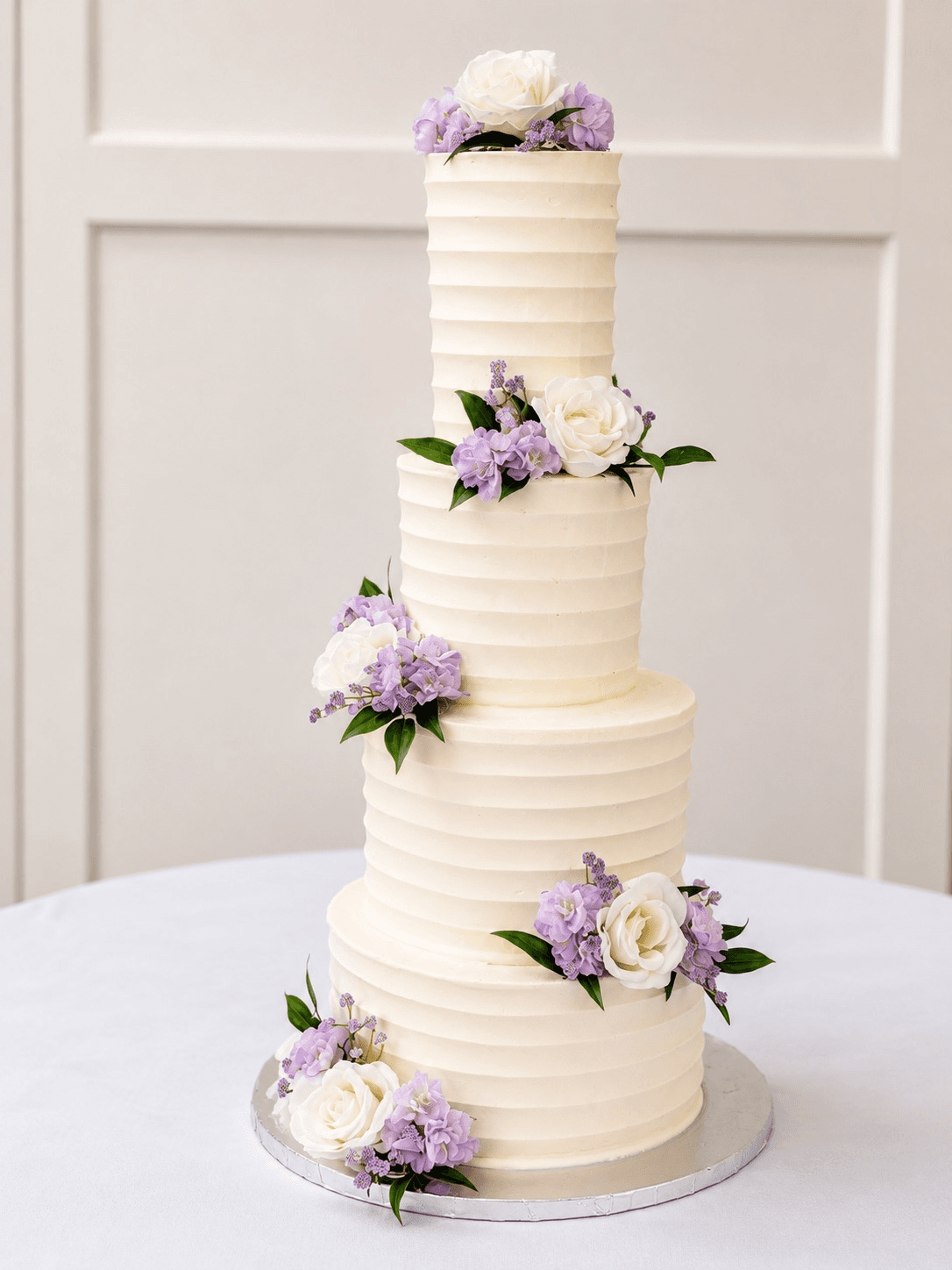 A wedding cake displayed for a reception.